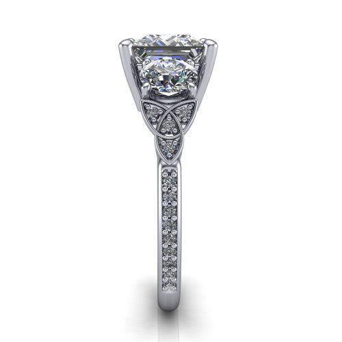 Zion princess three stone engagement ring in 14K White Gold, side profile showing the trinity-knot shoulder and the pav&eacute; diamonds running down the shank