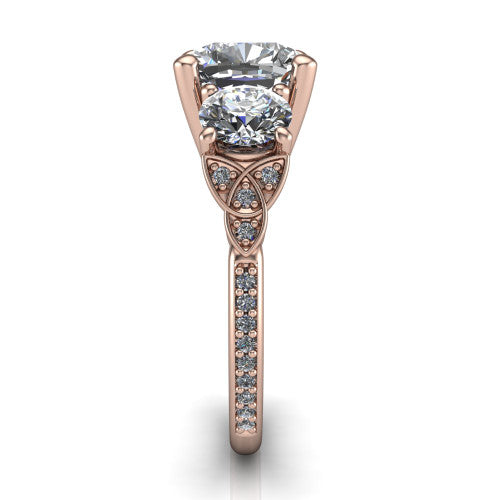 Zion cushion three stone engagement ring in 18K Rose Gold, side profile showing the trinity-knot shoulder and the pav&eacute; diamonds running down the shank