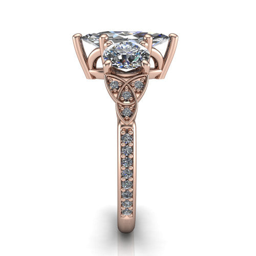 Zion marquise three stone engagement ring in 14K Rose Gold, side profile showing the trinity-knot shoulder and the pav&eacute; diamonds running down the shank