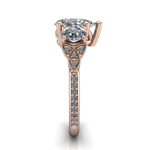 Zion pear three stone engagement ring in 14K Rose Gold, side profile showing the trinity-knot shoulder and the pav&eacute; diamonds running down the shank