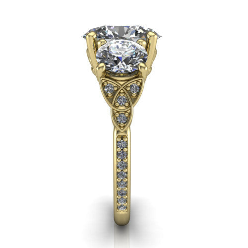 Zion oval three stone engagement ring in 14K Yellow Gold, side profile showing the trinity-knot shoulder and the pav&eacute; diamonds running down the shank
