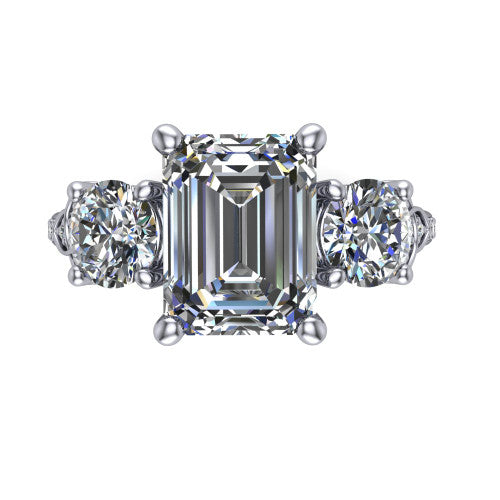 Zion emerald three stone engagement ring in 18K White Gold, top-down view showing the center diamond flanked by two round side stones and trinity-knot shoulder detailing