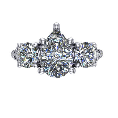 Zion pear three stone engagement ring in Platinum, top-down view showing the center diamond flanked by two round side stones and trinity-knot shoulder detailing