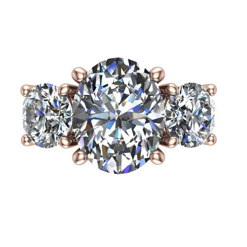 Zion oval three stone engagement ring in 18K Rose Gold, top-down view showing the center diamond flanked by two round side stones and trinity-knot shoulder detailing