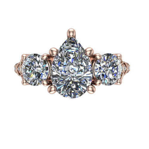 Zion pear three stone engagement ring in 18K Rose Gold, top-down view showing the center diamond flanked by two round side stones and trinity-knot shoulder detailing