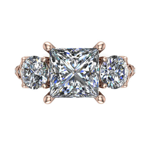 Zion princess three stone engagement ring in 18K Rose Gold, top-down view showing the center diamond flanked by two round side stones and trinity-knot shoulder detailing