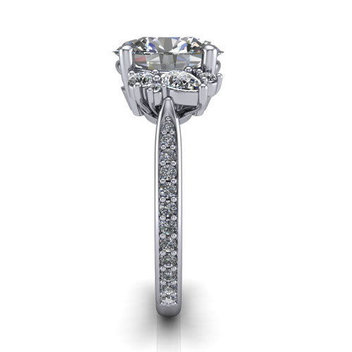 Mila oval three stone engagement ring in 14K White Gold, side profile showing the round accent cluster and the pav&eacute; diamonds running down the shank