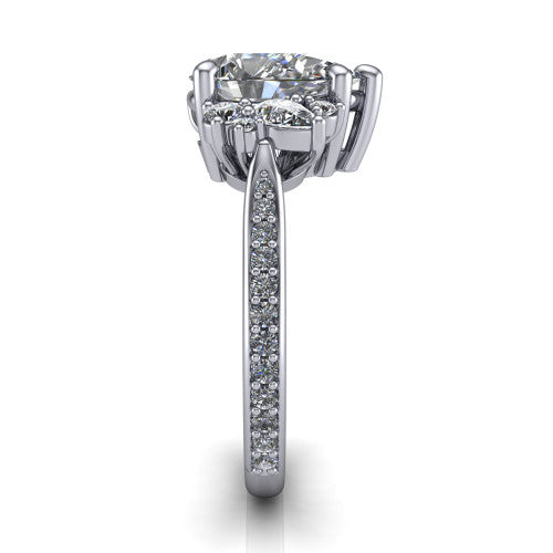 Mila pear three stone engagement ring in 14K White Gold, side profile showing the round accent cluster and the pav&eacute; diamonds running down the shank