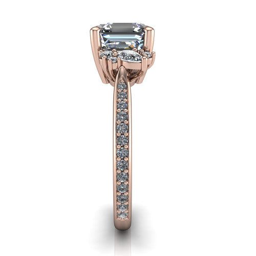 Mila asscher three stone engagement ring in 14K Rose Gold, side profile showing the round accent cluster and the pav&eacute; diamonds running down the shank