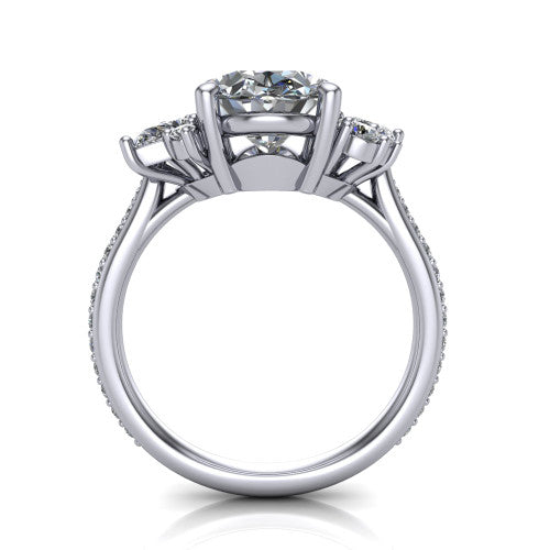 Mila oval three stone engagement ring in Platinum, through-finger front profile showing the center head raised above the round accent clusters and pav&eacute; band