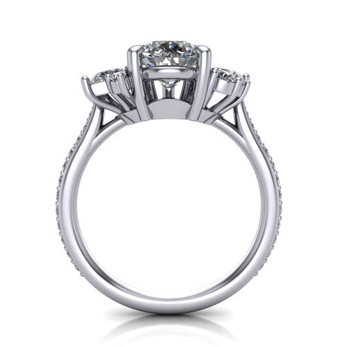 Mila pear three stone engagement ring in 18K White Gold, through-finger front profile showing the center head raised above the round accent clusters and pav&eacute; band