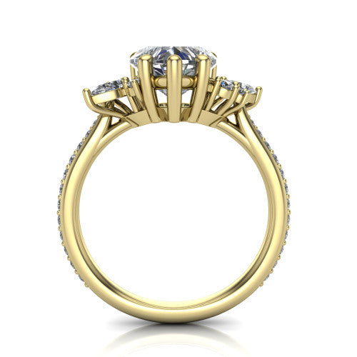 Mila heart three stone engagement ring in 18K Yellow Gold, through-finger front profile showing the center head raised above the round accent clusters and pav&eacute; band