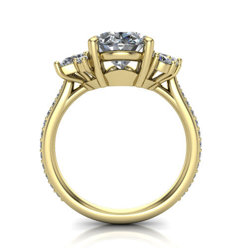 Mila oval three stone engagement ring in 14K Yellow Gold, through-finger front profile showing the center head raised above the round accent clusters and pav&eacute; band