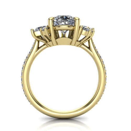 Mila pear three stone engagement ring in 14K Yellow Gold, through-finger front profile showing the center head raised above the round accent clusters and pav&eacute; band