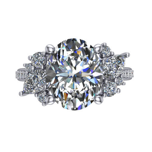 Mila oval three stone engagement ring in 14K White Gold, top-down view showing the center diamond between two trios of round accent diamonds