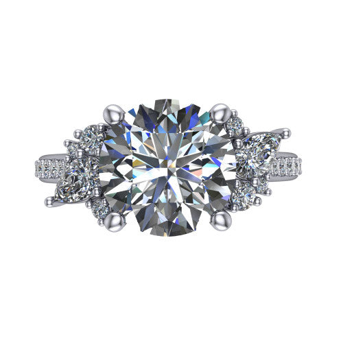 Mila round three stone engagement ring in Platinum, top-down view showing the center diamond between two trios of round accent diamonds
