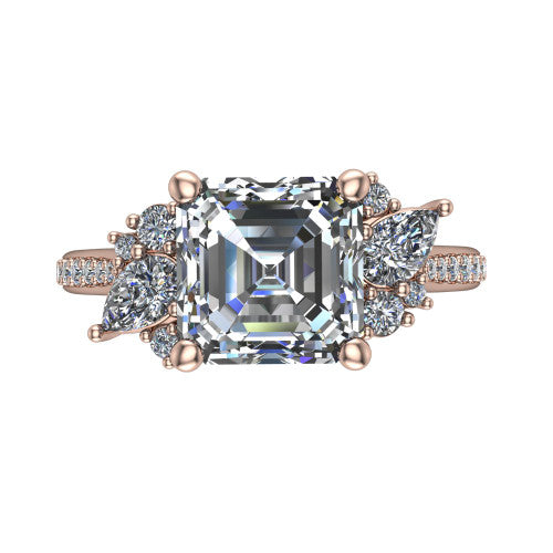 Mila asscher three stone engagement ring in 18K Rose Gold, top-down view showing the center diamond between two trios of round accent diamonds