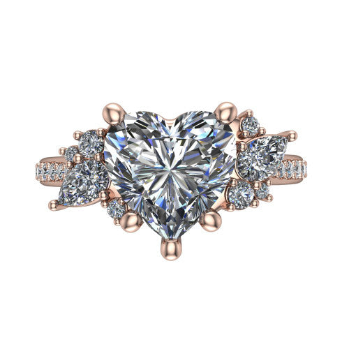 Mila heart three stone engagement ring in 18K Rose Gold, top-down view showing the center diamond between two trios of round accent diamonds