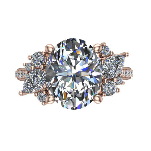 Mila oval three stone engagement ring in 18K Rose Gold, top-down view showing the center diamond between two trios of round accent diamonds