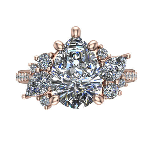 Mila pear three stone engagement ring in 14K Rose Gold, top-down view showing the center diamond between two trios of round accent diamonds