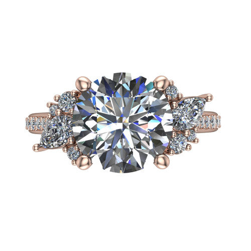 Mila round three stone engagement ring in 18K Rose Gold, top-down view showing the center diamond between two trios of round accent diamonds