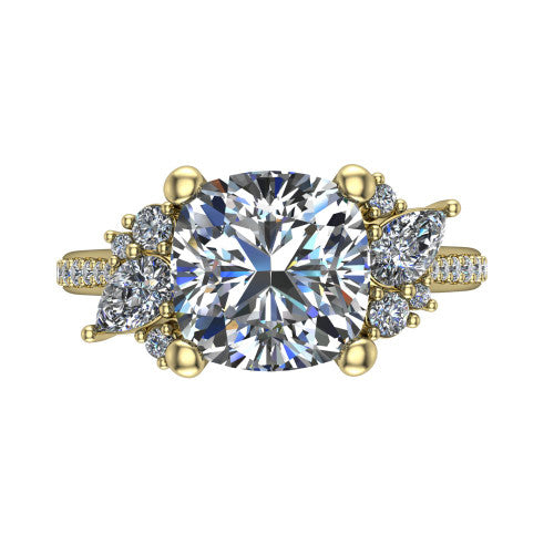 Mila cushion three stone engagement ring in 14K Yellow Gold, top-down view showing the center diamond between two trios of round accent diamonds