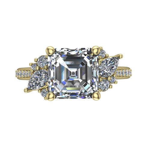 Mila asscher three stone engagement ring in 18K Yellow Gold, top-down view showing the center diamond between two trios of round accent diamonds