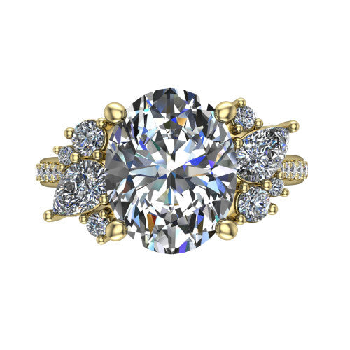 Mila oval three stone engagement ring in 18K Yellow Gold, top-down view showing the center diamond between two trios of round accent diamonds