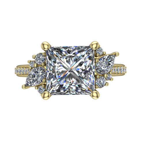 Mila princess three stone engagement ring in 14K Yellow Gold, top-down view showing the center diamond between two trios of round accent diamonds