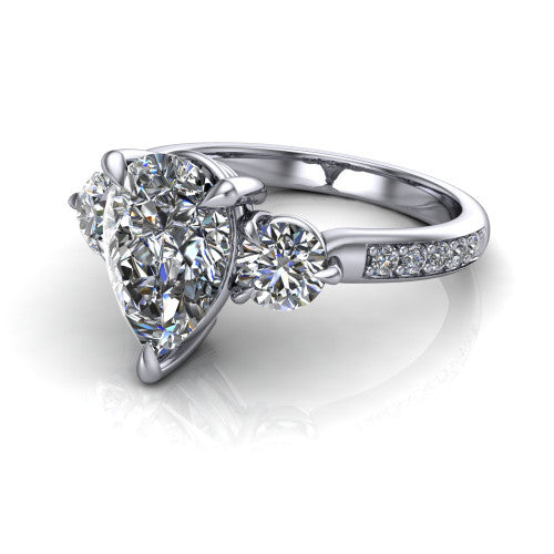 Blake pear three stone engagement ring in 18K White Gold, three-quarter perspective showing the center diamond between two round side stones above a pav&eacute; shank