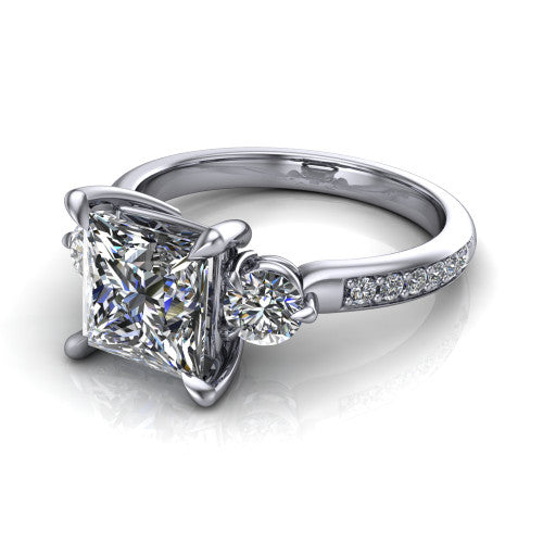 Blake princess three stone engagement ring in 14K White Gold, three-quarter perspective showing the center diamond between two round side stones above a pav&eacute; shank