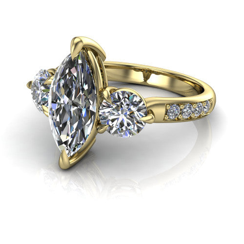 Blake marquise three stone engagement ring in 14K Yellow Gold, three-quarter perspective showing the center diamond between two round side stones above a pav&eacute; shank