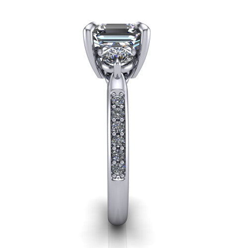 Blake asscher three stone engagement ring in Platinum, side profile showing the round side stone and the pav&eacute; diamonds running down the shank