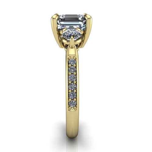Blake asscher three stone engagement ring in 18K Yellow Gold, side profile showing the round side stone and the pav&eacute; diamonds running down the shank