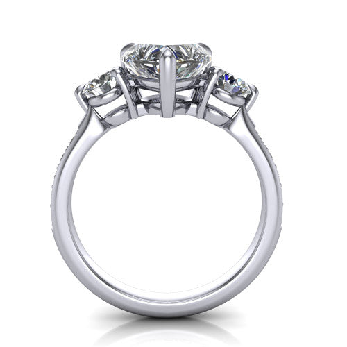 Blake heart three stone engagement ring in Platinum, through-finger front profile showing the three-stone head raised above the pav&eacute; band