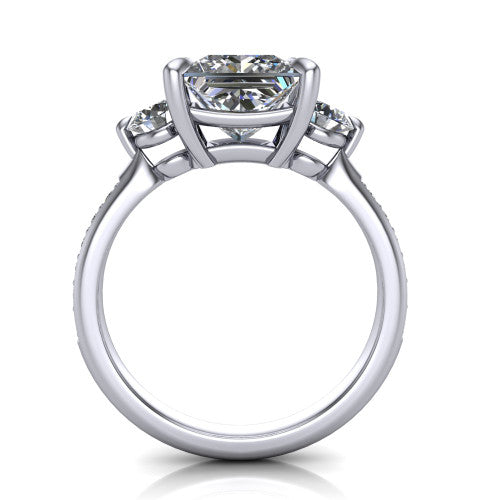 Blake princess three stone engagement ring in 18K White Gold, through-finger front profile showing the three-stone head raised above the pav&eacute; band