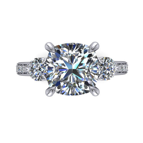 Blake cushion three stone engagement ring in Platinum, top-down view showing the center diamond flanked by two round side stones in a classic three stone setting