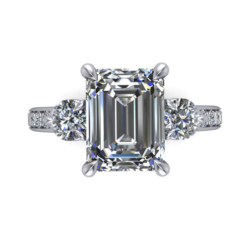 Blake emerald three stone engagement ring in 18K White Gold, top-down view showing the center diamond flanked by two round side stones in a classic three stone setting