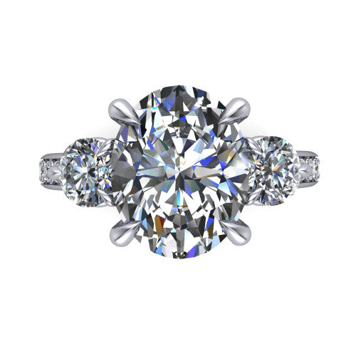 Blake oval three stone engagement ring in Platinum, top-down view showing the center diamond flanked by two round side stones in a classic three stone setting