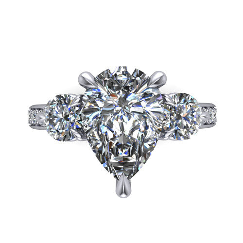 Blake pear three stone engagement ring in 18K White Gold, top-down view showing the center diamond flanked by two round side stones in a classic three stone setting