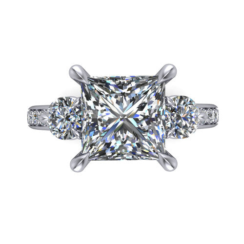 Blake princess three stone engagement ring in Platinum, top-down view showing the center diamond flanked by two round side stones in a classic three stone setting