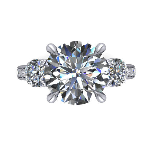 Blake round three stone engagement ring in Platinum, side profile showing the round side stone and the pav&eacute; diamonds running down the shank