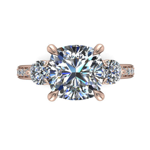 Blake cushion three stone engagement ring in 14K Rose Gold, top-down view showing the center diamond flanked by two round side stones in a classic three stone setting
