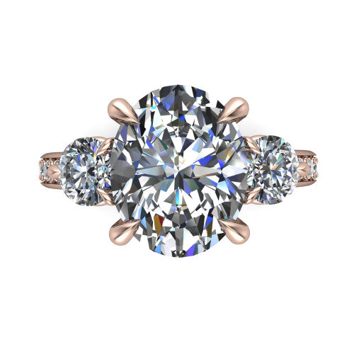 Blake oval three stone engagement ring in 18K Rose Gold, top-down view showing the center diamond flanked by two round side stones in a classic three stone setting