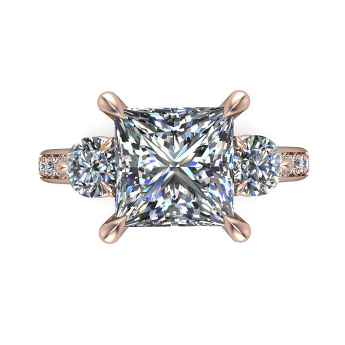 Blake princess three stone engagement ring in 14K Rose Gold, top-down view showing the center diamond flanked by two round side stones in a classic three stone setting