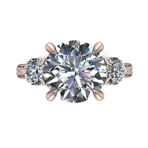 Blake round three stone engagement ring in 18K Rose Gold, through-finger front profile showing the three-stone head raised above the pav&eacute; band