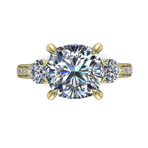 Blake cushion three stone engagement ring in 18K Yellow Gold, top-down view showing the center diamond flanked by two round side stones in a classic three stone setting