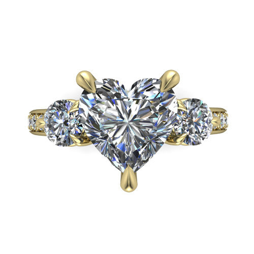 Blake heart three stone engagement ring in 18K Yellow Gold, top-down view showing the center diamond flanked by two round side stones in a classic three stone setting