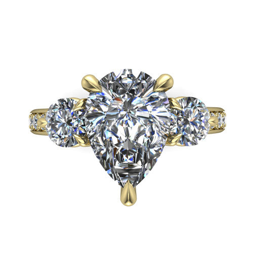 Blake pear three stone engagement ring in 14K Yellow Gold, top-down view showing the center diamond flanked by two round side stones in a classic three stone setting