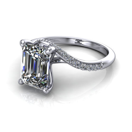 Aurora emerald classic engagement ring in Platinum, three-quarter perspective showing the solitaire center diamond above a twisting pav&eacute; bypass shank